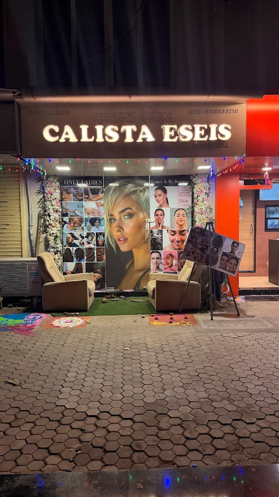 Calista Eseis salon storefront in Mumbai lit up at night